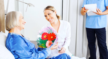 senior woman talking with caregiver