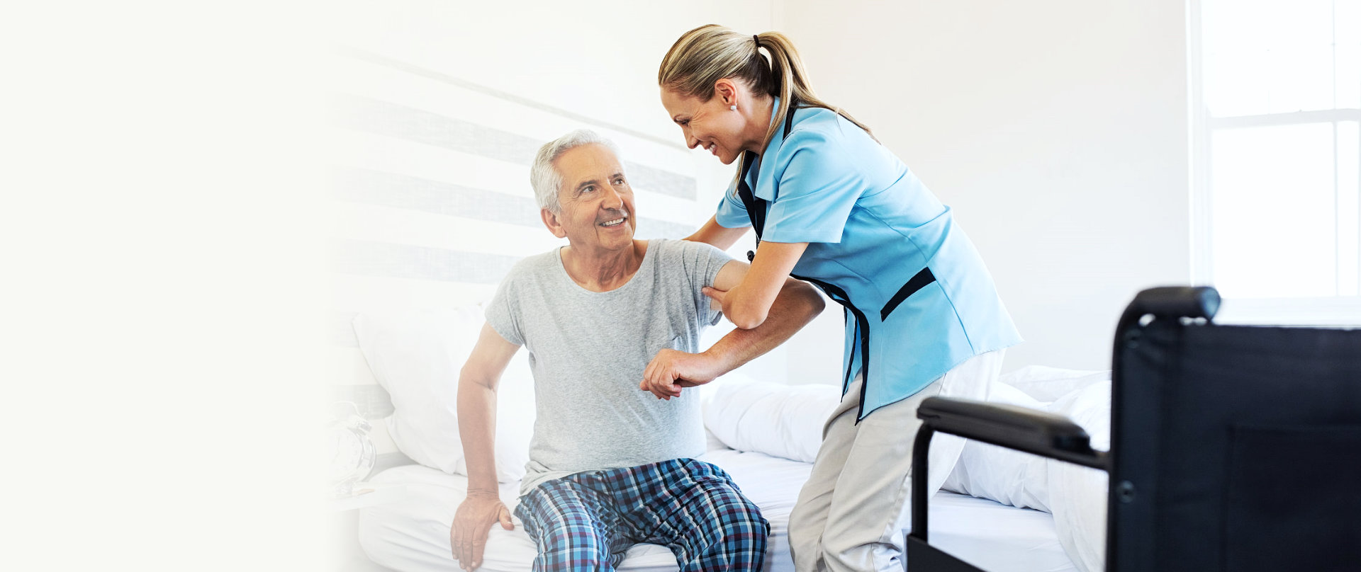 caregiver helping senior man