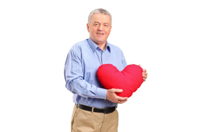 senior man  holding a heart