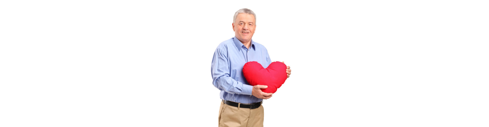 senior man holding a heart